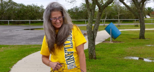 Sharon Knoll on rollerskates walking a dog