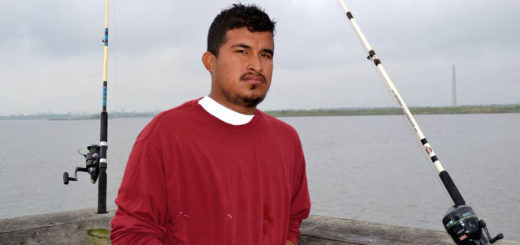 Young man fishing on pier
