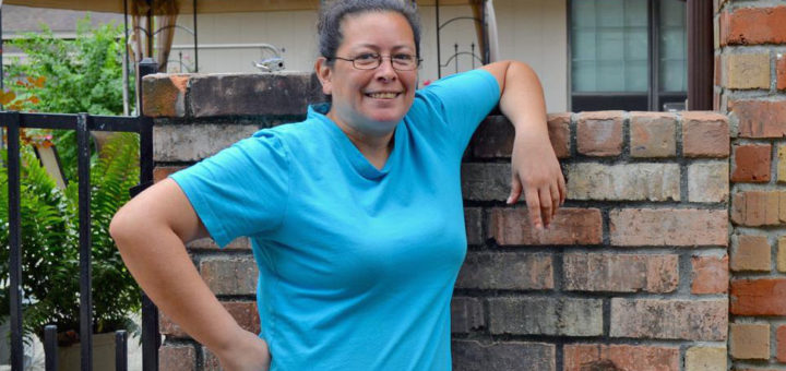 Woman stands at garage sale