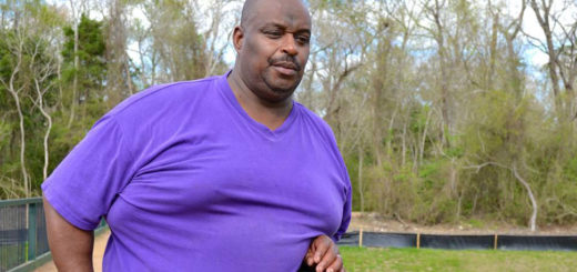Man stands on bridge