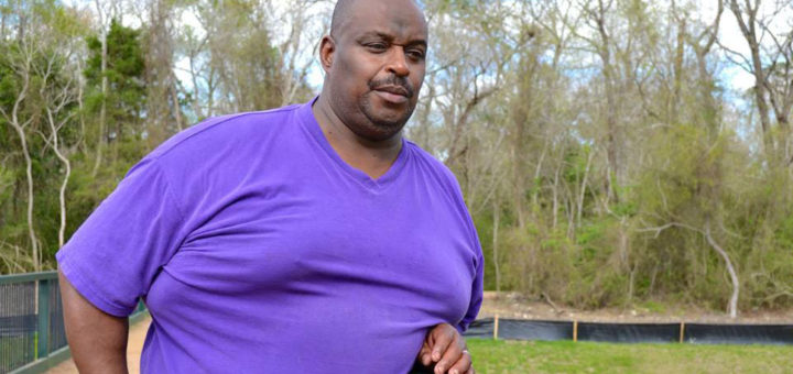 Man stands on bridge