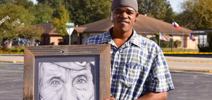 Welton Williams holds a drawing