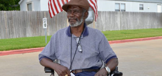 Man in scooter waiting for a bus