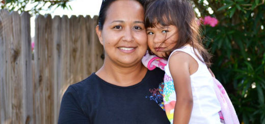 Mom holds youngest daughter