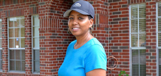 Woman in front of her house