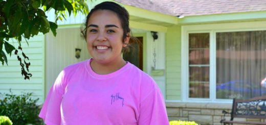 Baby sister in front yard