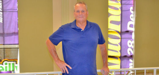 Man renovating old bank building