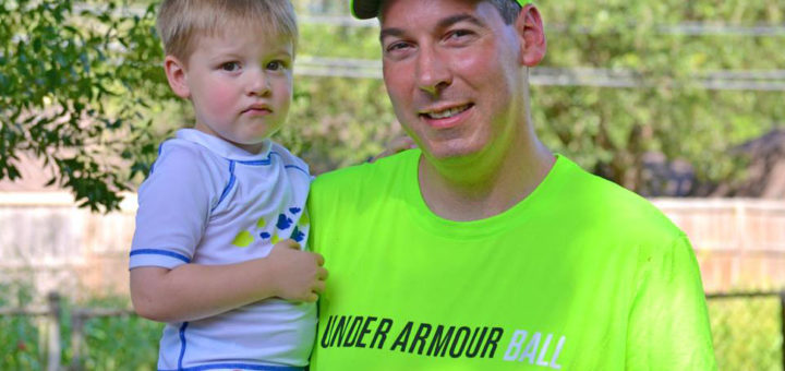 Basketball coach holds son