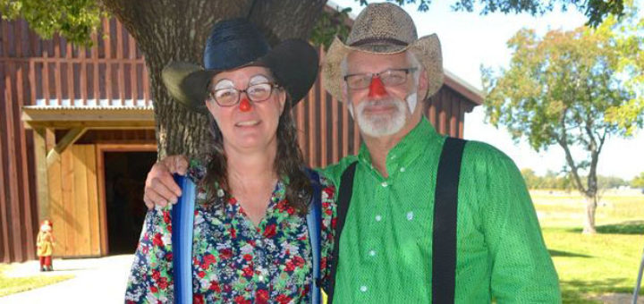Husband and wife dressed as clowns