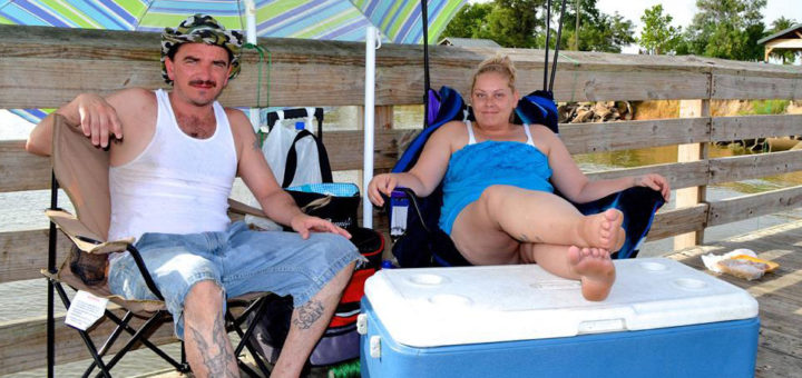 Engaged couple on fishing pier