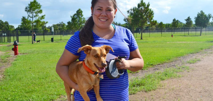 Girl holding dog