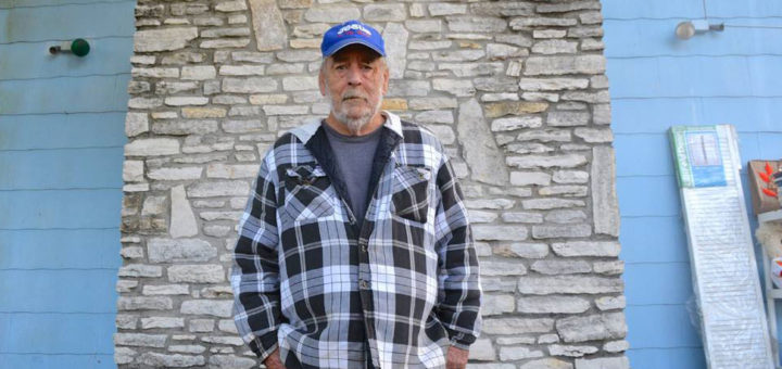 Man stands in his driveway