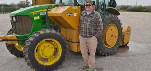 Hunting guide stands near tractor