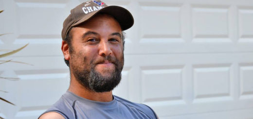 Young man sits in driveway