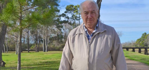 Retired longshoreman walks his dog at park