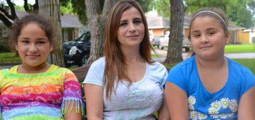 Mother sits with two daughters