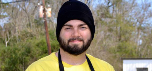Young man outdoors wearing hat