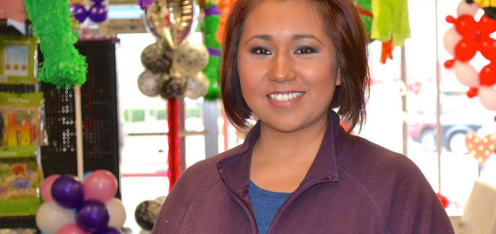 Woman stands in party store