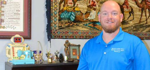 Resale shop owner in store