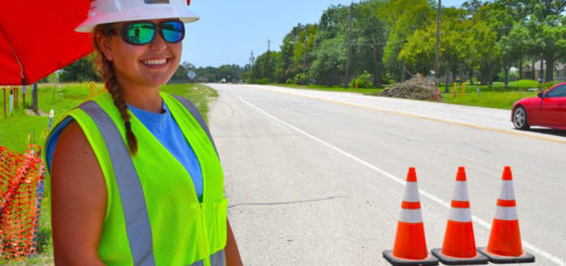 Young woman stands near truck