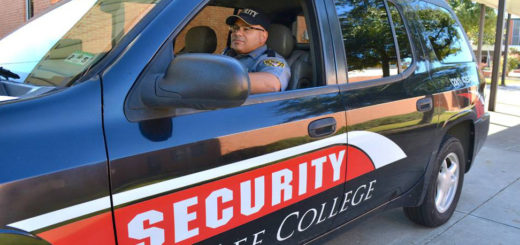 Security officer sits in his vehicle