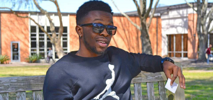 Student on bench at Lee College