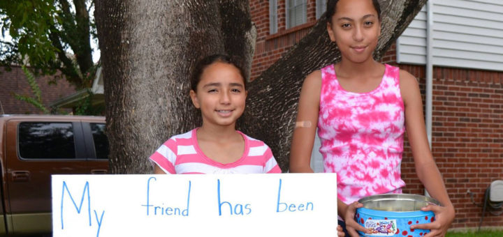 Sisters in yard raising money