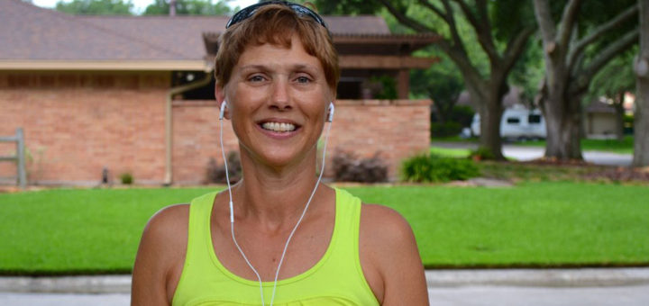 Woman stands in driveway