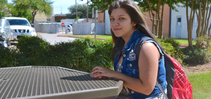 Student sits at Lee College campus