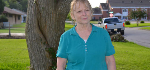Woman stands in yard