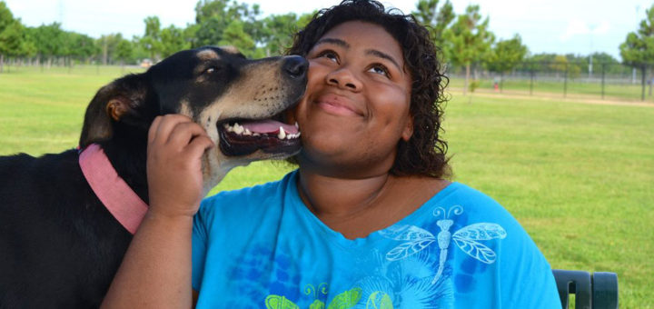 Woman hugging her dog