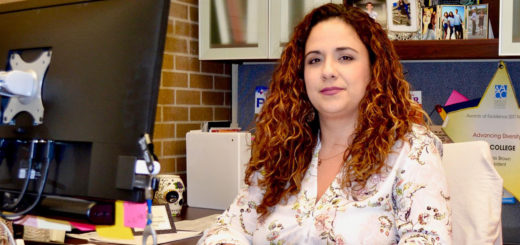 Victoria Marron sits at her desk