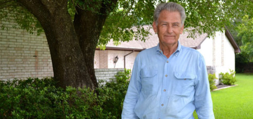 Man stands in his yard