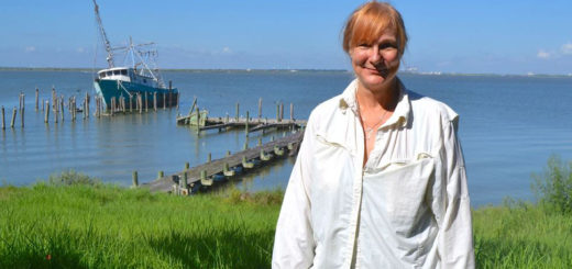 Widow stands in her yard