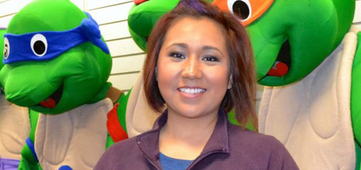 Woman stands in party store