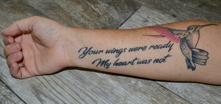 Arm tattoo of a hummingbird