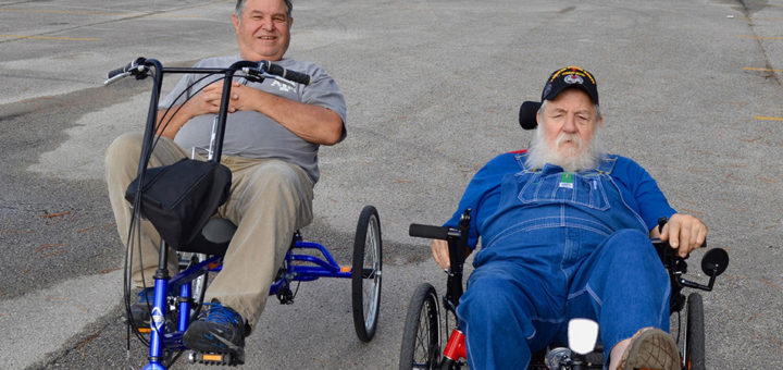 K.C. Compton and Mike Gilbert ride bikes