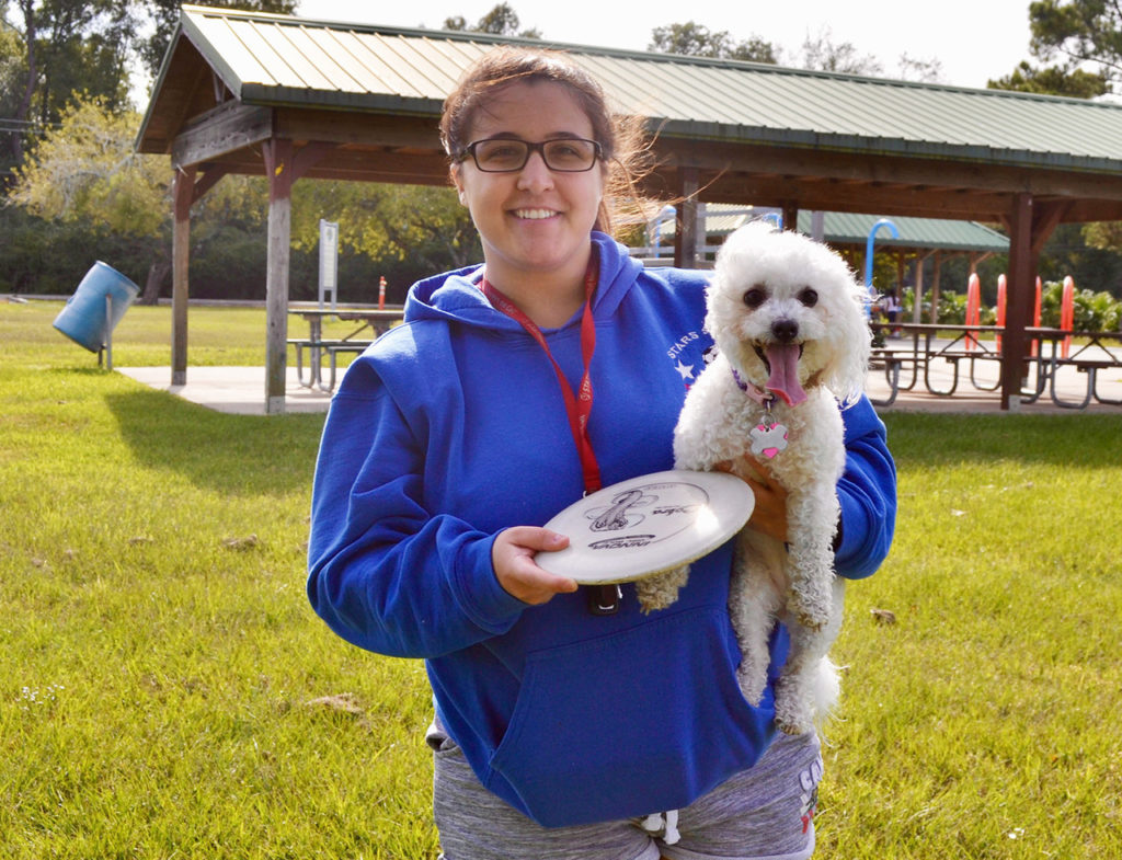 Alex Winters holds her dog
