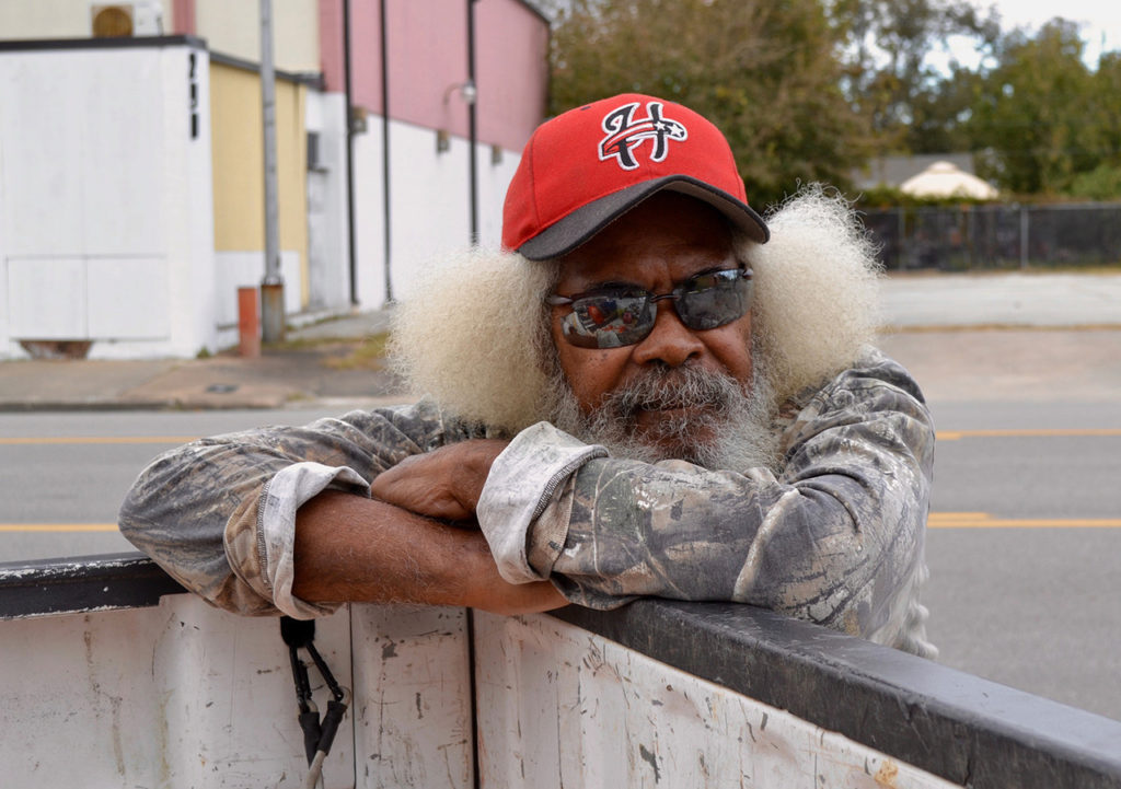 Glen Henson leans on a truck bed
