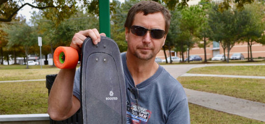 Tony Wo holds his skateboard