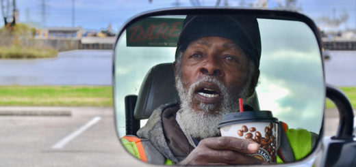 Albert Jack's image in a truck's side mirror