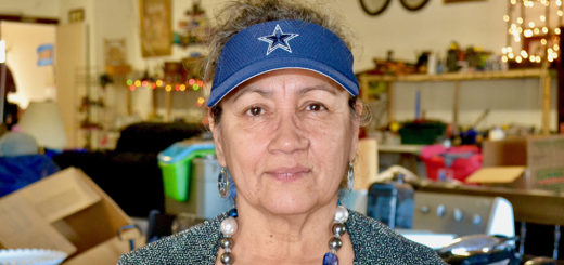 Mary Delgado stands in her thrift shop