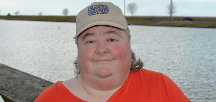 Glenda George stands on a fishing pier