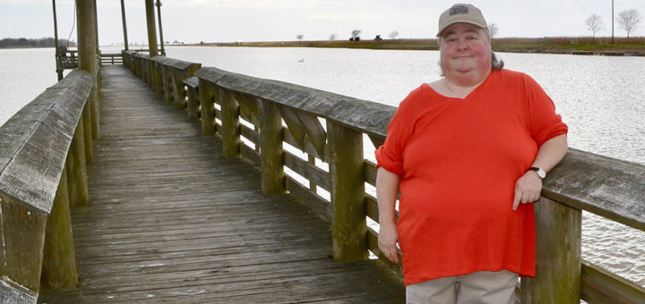Glenda George stands on fishing pier
