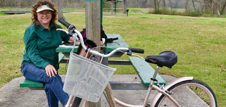 Elizabeth Rick sits near her bicycle